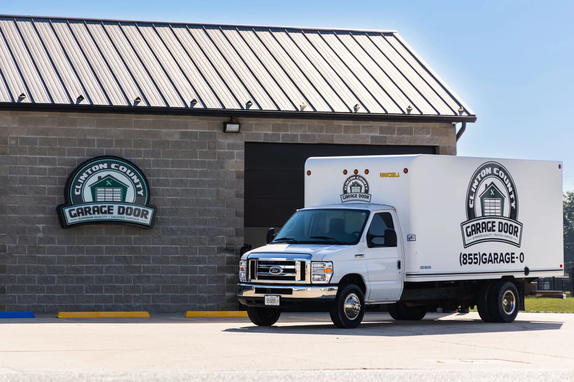 CC Garage Door box truck parked beside the shop sign in Aviston