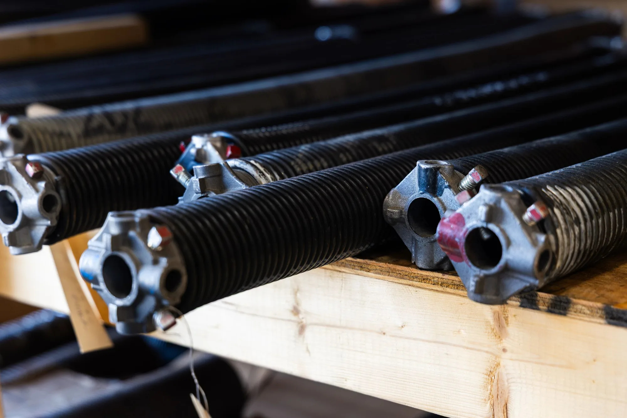 Torsion springs with winding cones stacked on a warehouse shelf